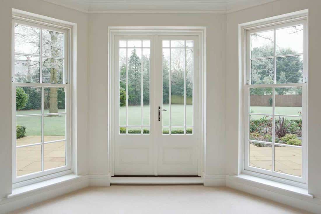 How does the aesthetic property of French doors help in ventilation?
